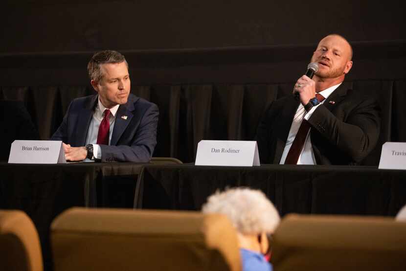 Brian Harrison (left) listens as Dan Rodimer answers questions during a forum for Republican...