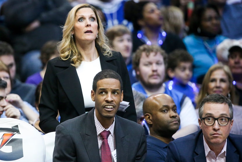 Mavericks assistant coach Jenny Boucek reacts to a play on the court during the first half...