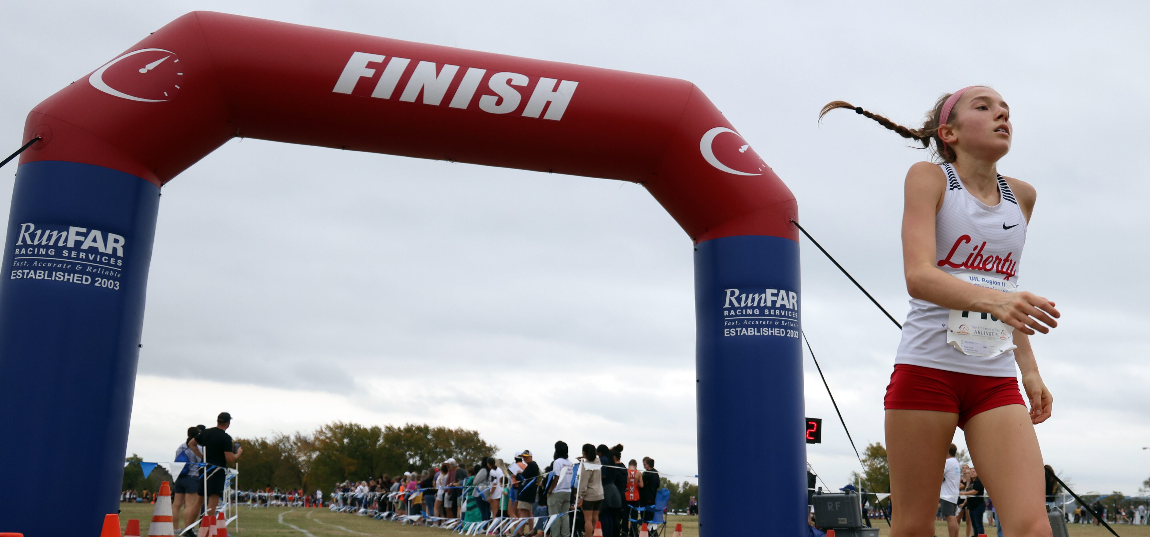 Frisco Liberty senior Sydni Wilkins crosses the finish line in the Girls 5A Region 2 with a...