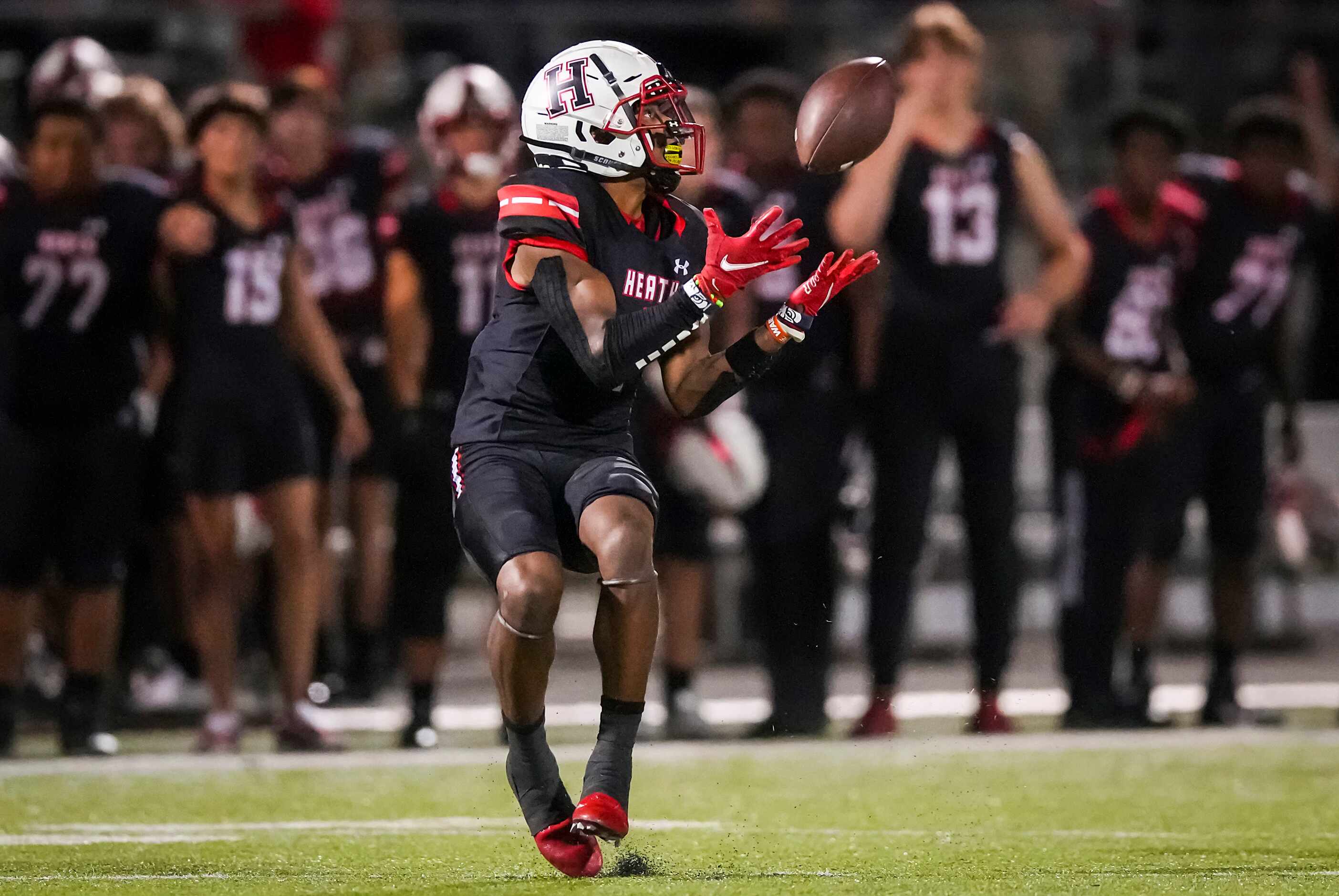 Rockwall-Heath wide receiver Jay Fair (1) hauls in a 69-yard touchdown reception as Rockwall...