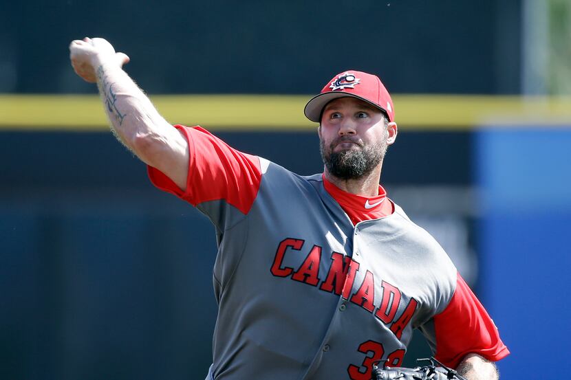 FILE - Canada pitcher Eric Gagne throws against the Toronto Blue Jays in an exhibition...