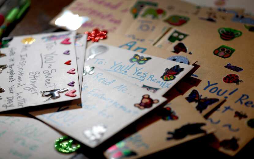 Cards that Angela Joy Bailey wrote sit on the table at her grandparents' home. 