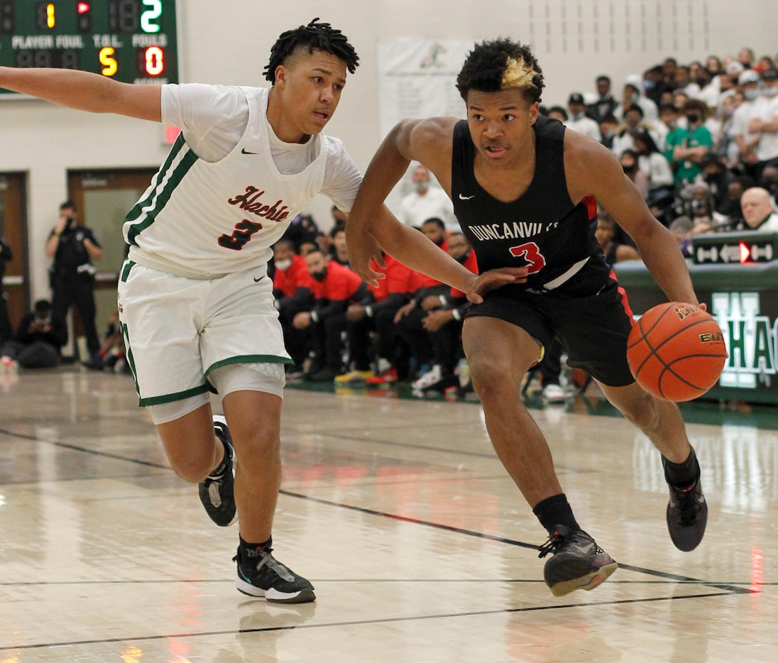 Duncanville's Caleb Ford (3), right, drives to the basket past the defense of Waxahachie's...