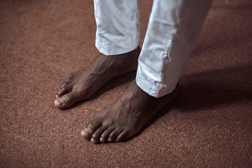 Abdoul, 32 year-old migrant from Maghama, Mauritania poses for a photograph at his shared...