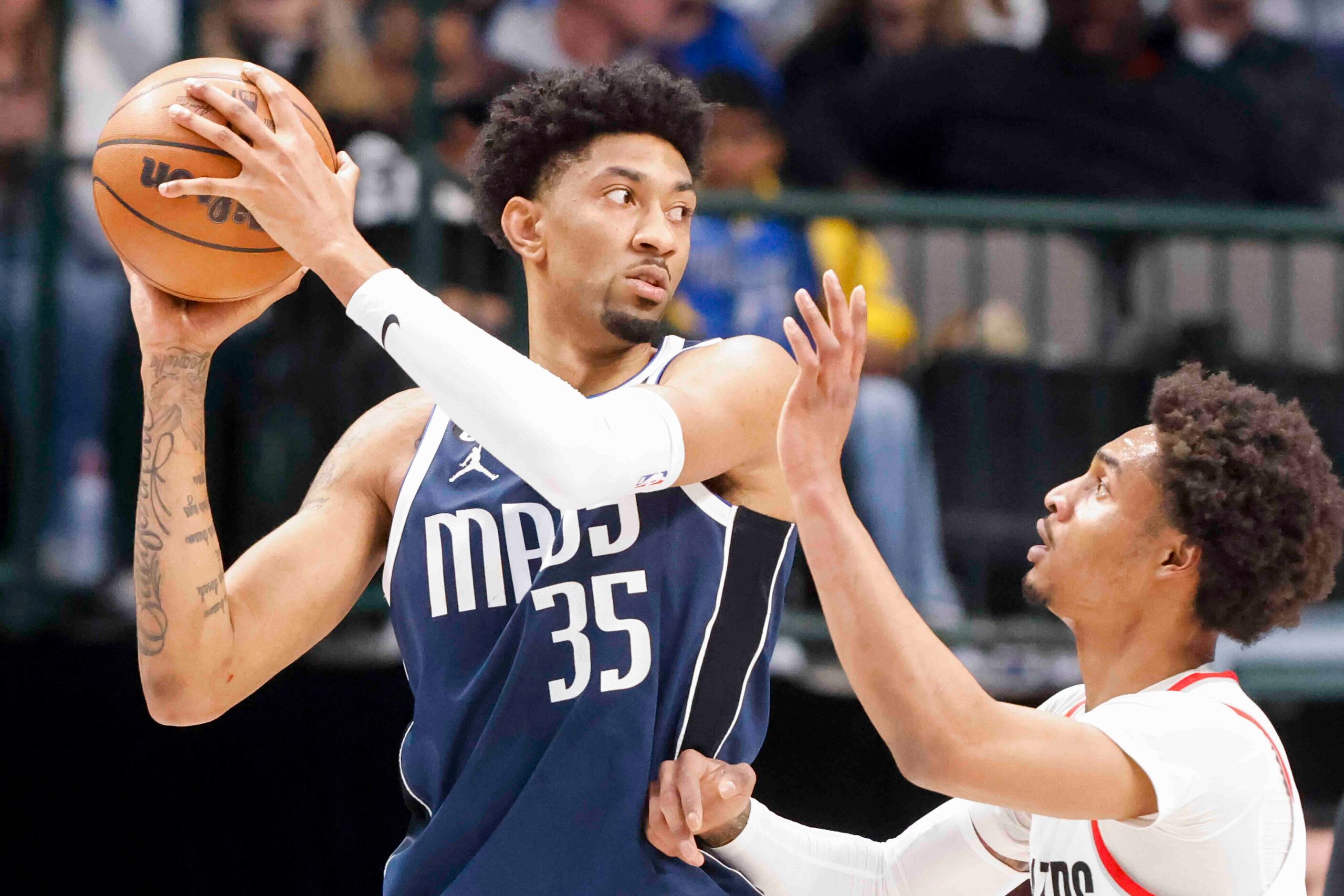 Dallas Mavericks forward Christian Wood (35) looks to pass the ball past Portland Trail...