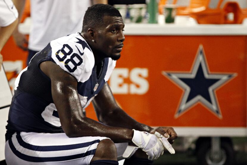 Dallas Cowboys wide receiver Dez Bryant sits on the bench dejected during the final seconds...