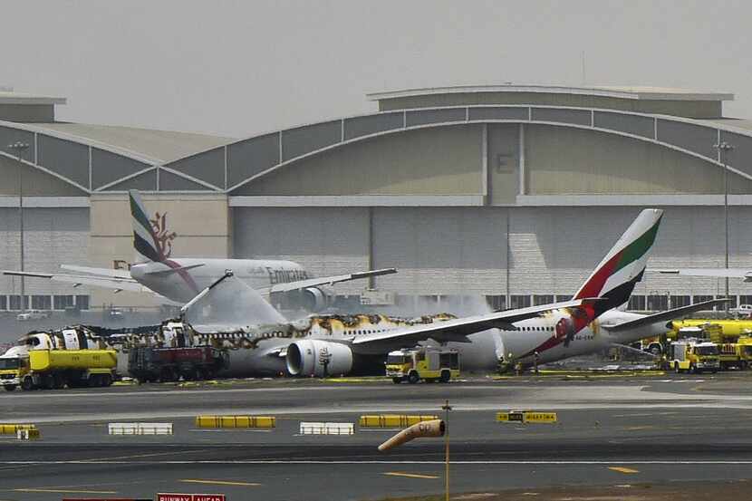 An Emirates airliner caught fire following a crash-landing at Dubai airport on Wednesday.   ...