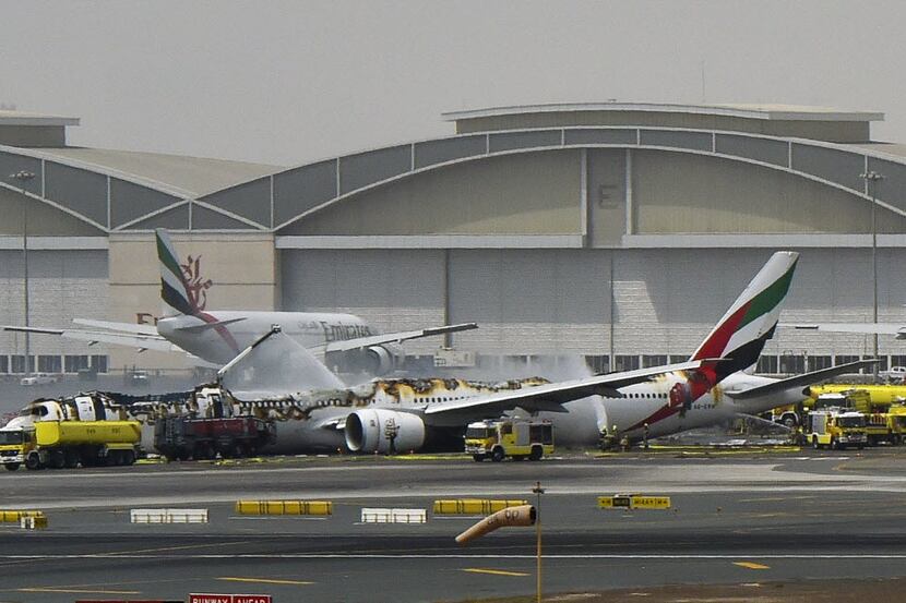 An Emirates airliner caught fire following a crash-landing at Dubai airport on Wednesday.   ...