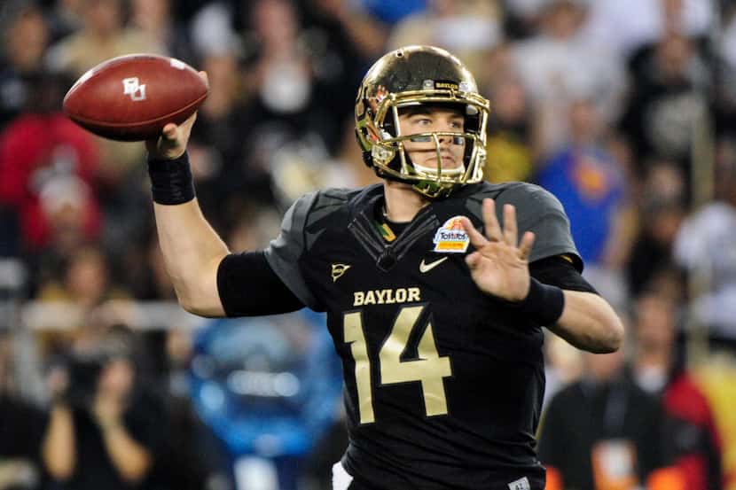 Baylor Bears quarterback Bryce Petty (14) throws during the second half against the UCF...
