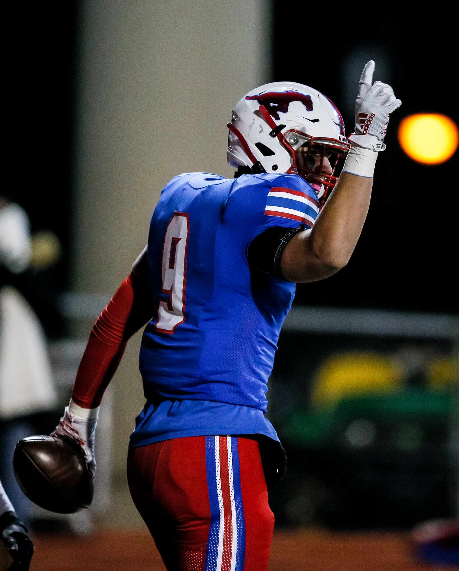 JJ Pearce senior halfback Dylan Adams celebrates a touchdown during the first half of a high...