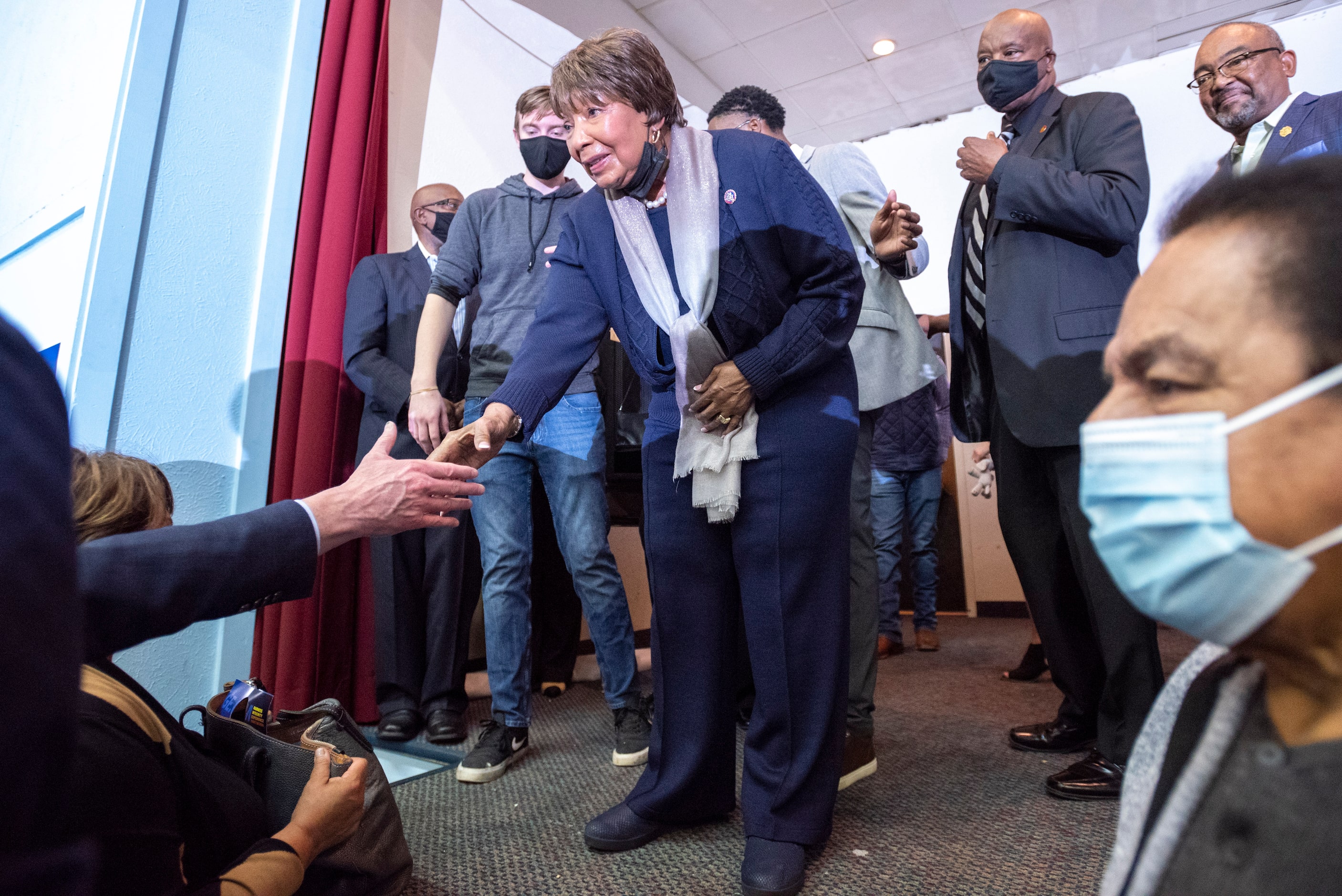 U.S. Rep. Eddie Bernice Johnson, center, is congratulated by Dallas County Judge Clay...