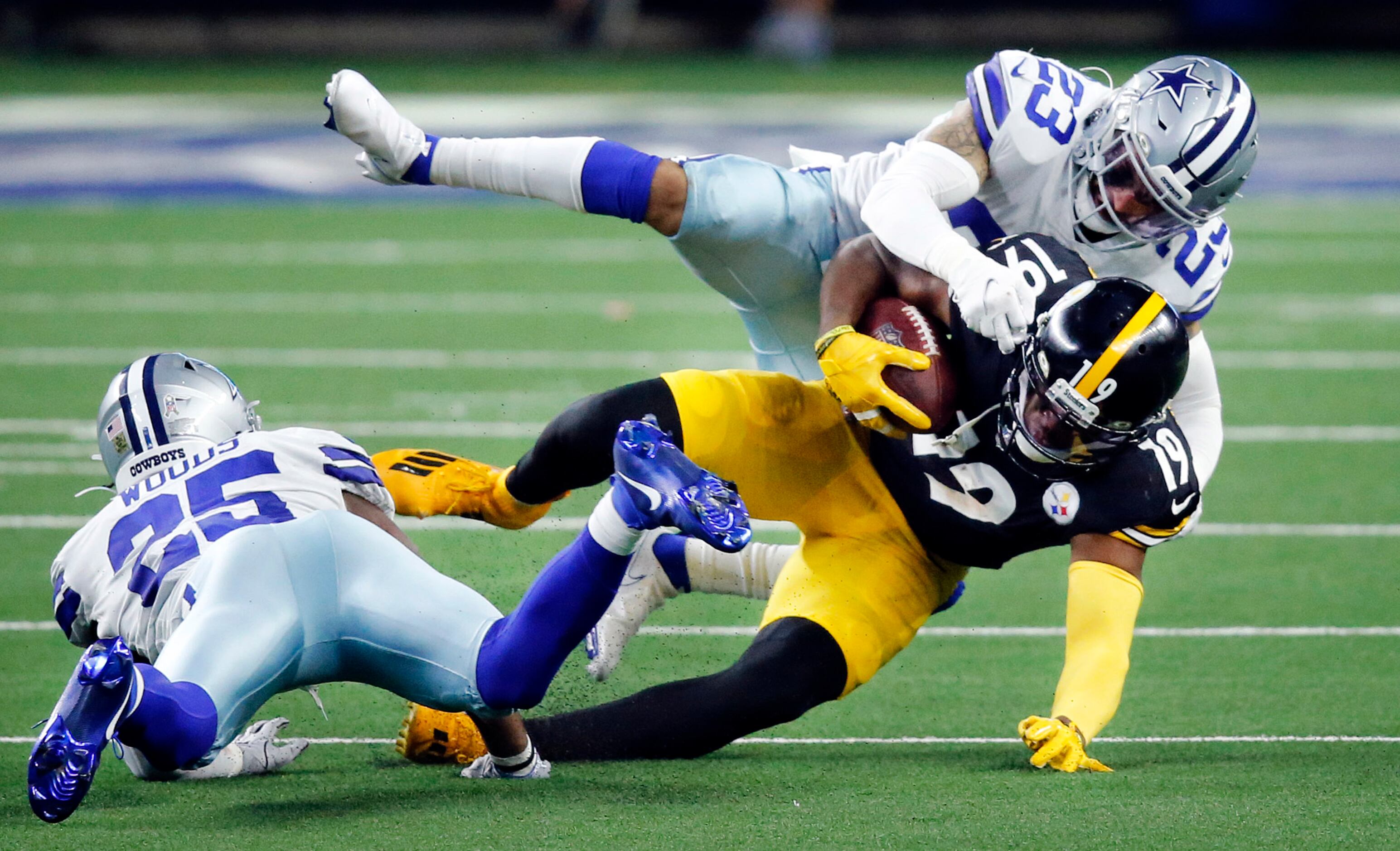 Pittsburgh Steelers wide receiver JuJu Smith-Schuster (19) is taken down by Dallas Cowboys...