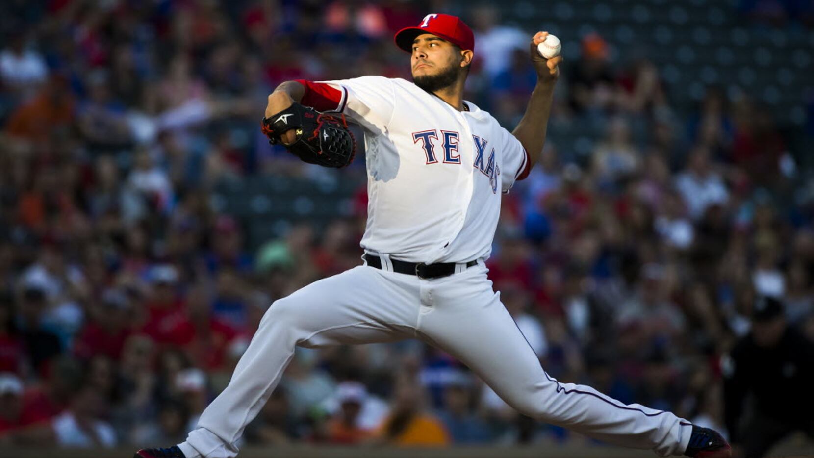 Texas Rangers pitcher Martin Perez delivers a pitch during the first inning against the...