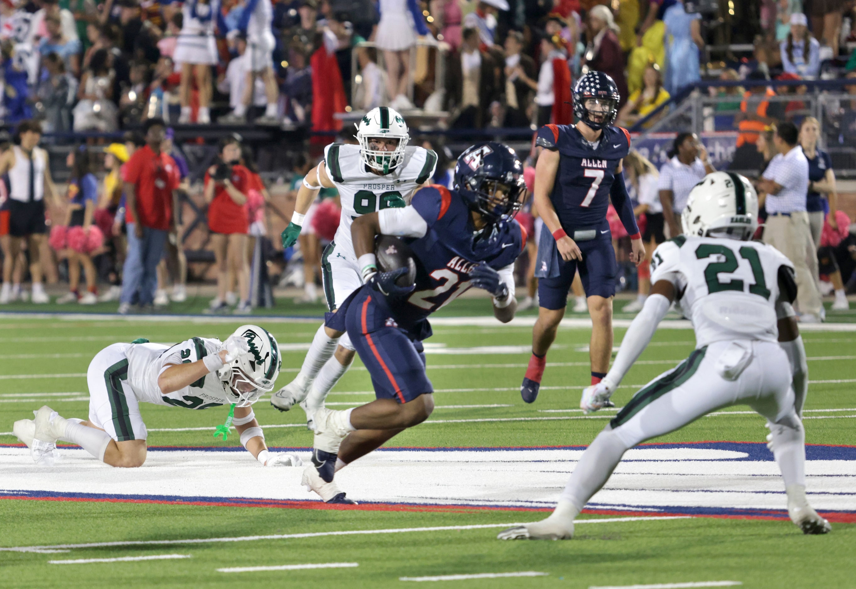 Allen player #21 Jaden Hambric runs the ball during the Prosper High School at Allen High...