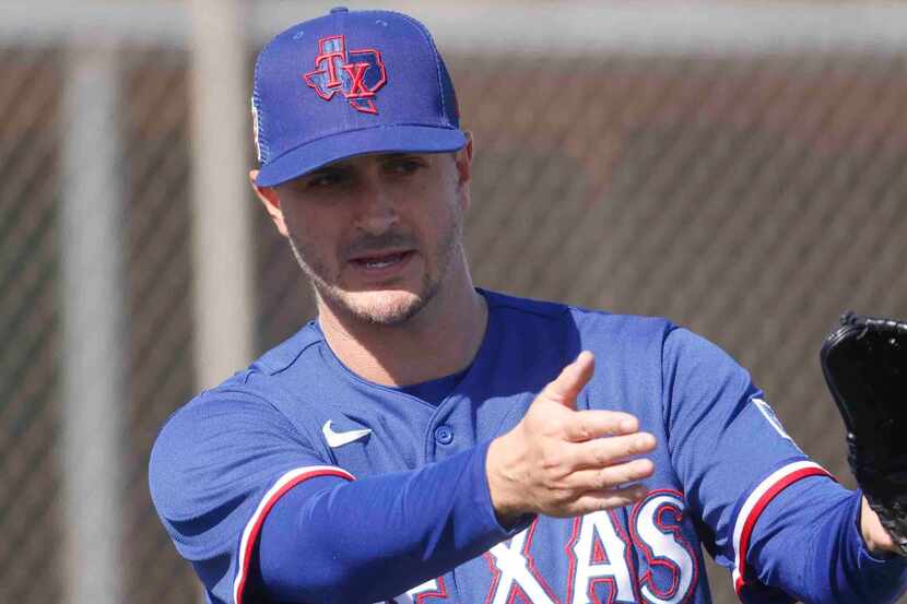 Texas Rangers minor league pitching coordinator Danny Clark, left, interacts with Texas...