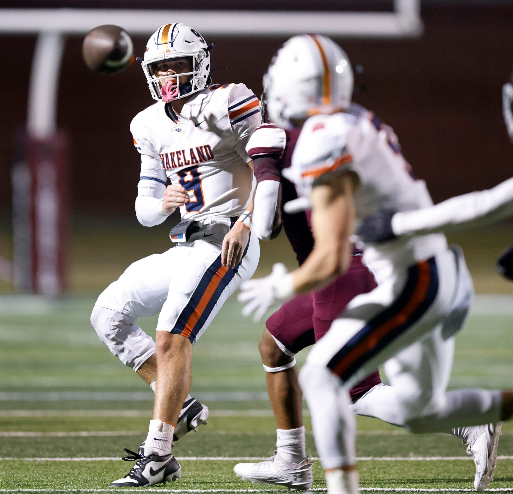 Frisco Wakeland  (9) slings a fourth quarter pass to wide receiver Ashdyn Kahouch (5)...