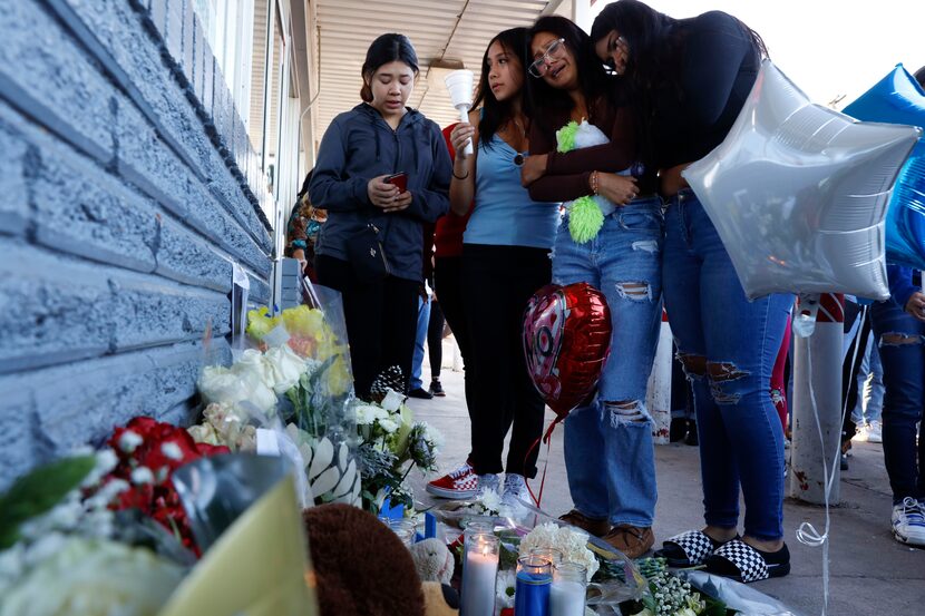 Friends of Xavier Gonzalez tried to comfort one another during the vigil.