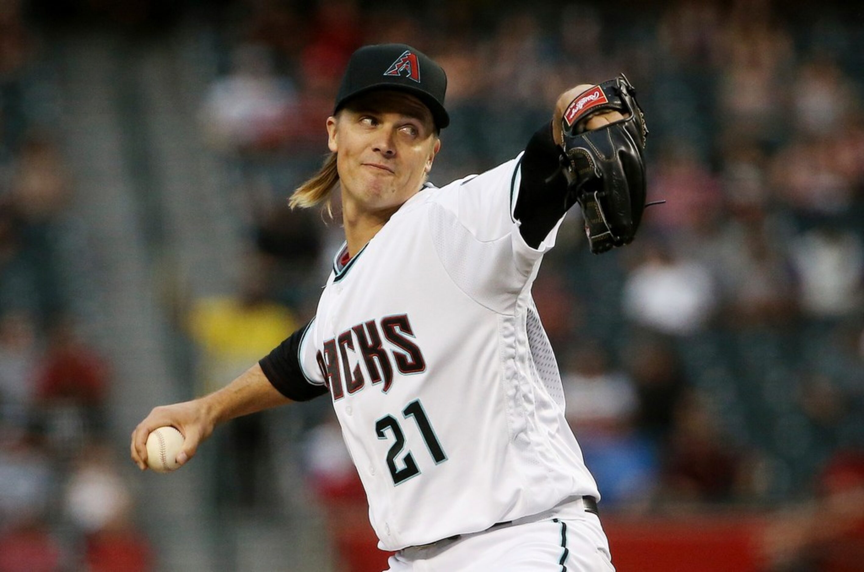 Arizona Diamondbacks starting pitcher Zack Greinke throws to a Texas Rangers batter during...