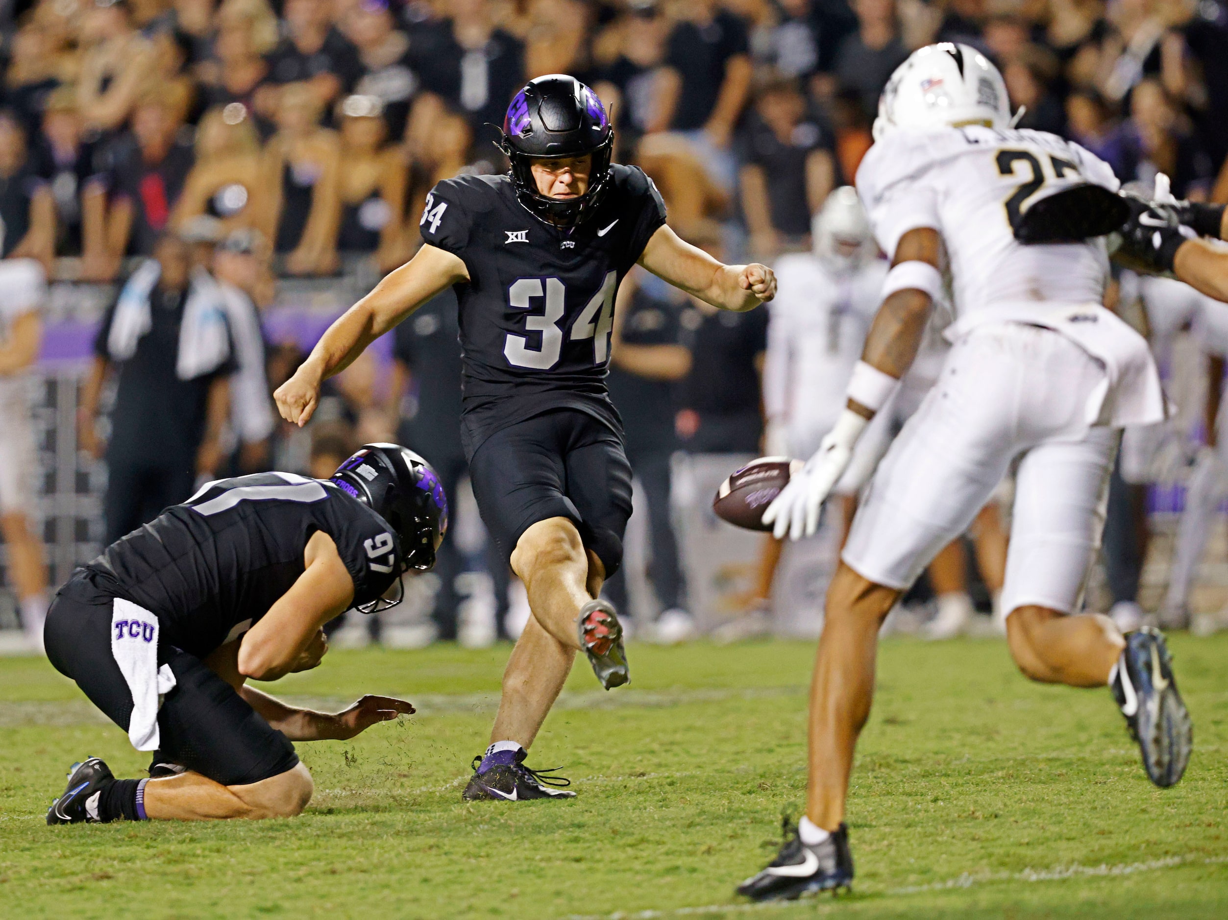 TCU place kicker Kyle Lemmermann (34) scores a field goal against UCF during the second half...