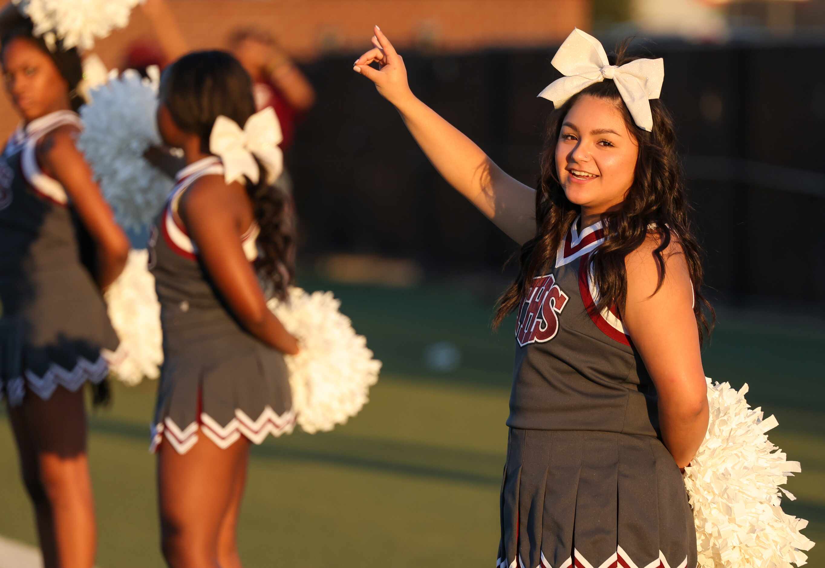 Mansfield Timberview cheerleaders move along to the school’s song before a game against...