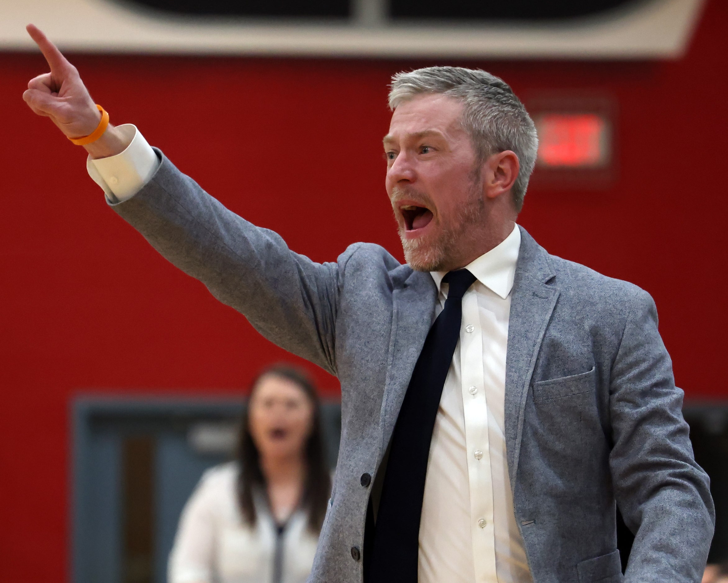 Highland Park head coach Todd Monsey directs his players from the team bench area during...