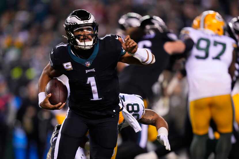 Philadelphia Eagles quarterback Jalen Hurts runs during the second half of an NFL football...