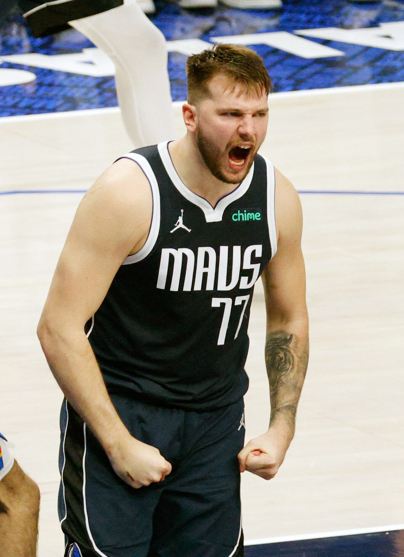 Dallas Mavericks guard Luka Doncic (77) reacts after he scored against Oklahoma City Thunder...