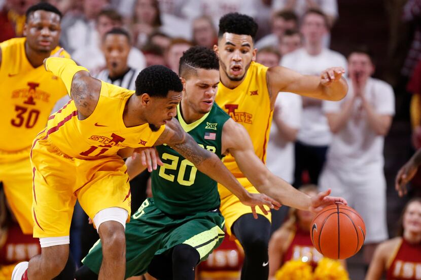 AMES, IA - FEBRUARY 25: Manu Lecomte #20 of the Baylor Bears battles for the ball with Monte...