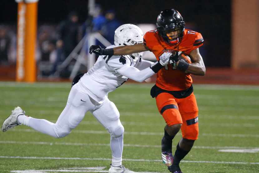 Rockwall's Jaxon Smith-Njigba (right) leads the Dallas area in receiving with 58 catches for...