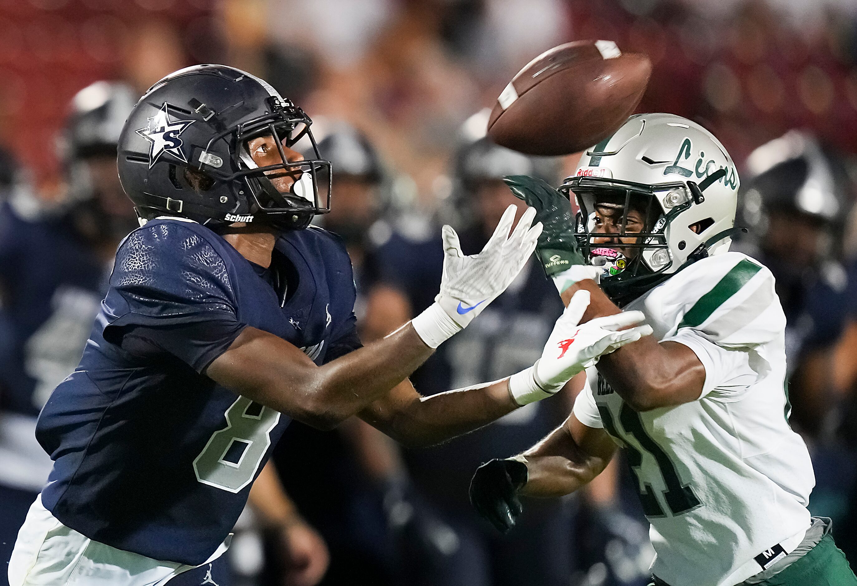 Frisco Lone Star wide receiver Winson Pollard (8) reaches for a pass as Frisco Reedy...