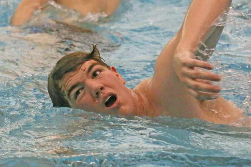 
Josiah Panak, 15, swims after the ball during practice. He participates with a club team in...