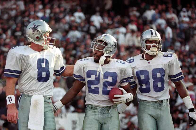 1995 - Dallas Cowboys (L-R) Troy Aikman, Emmitt Smith and Michael Irvin celebrate after...