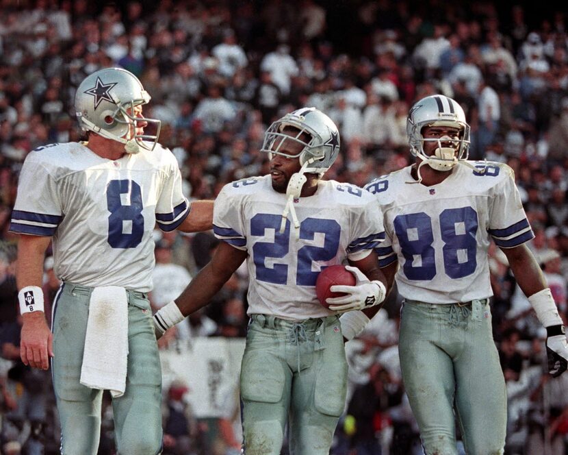 1995 - Dallas Cowboys (L-R) Troy Aikman, Emmitt Smith and Michael Irvin celebrate after...