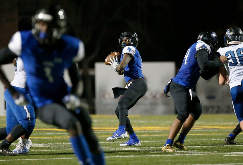 Trinity Christian-Cedar Hill quarterback Shedeur Sanders (2) throws a pass downfield during...