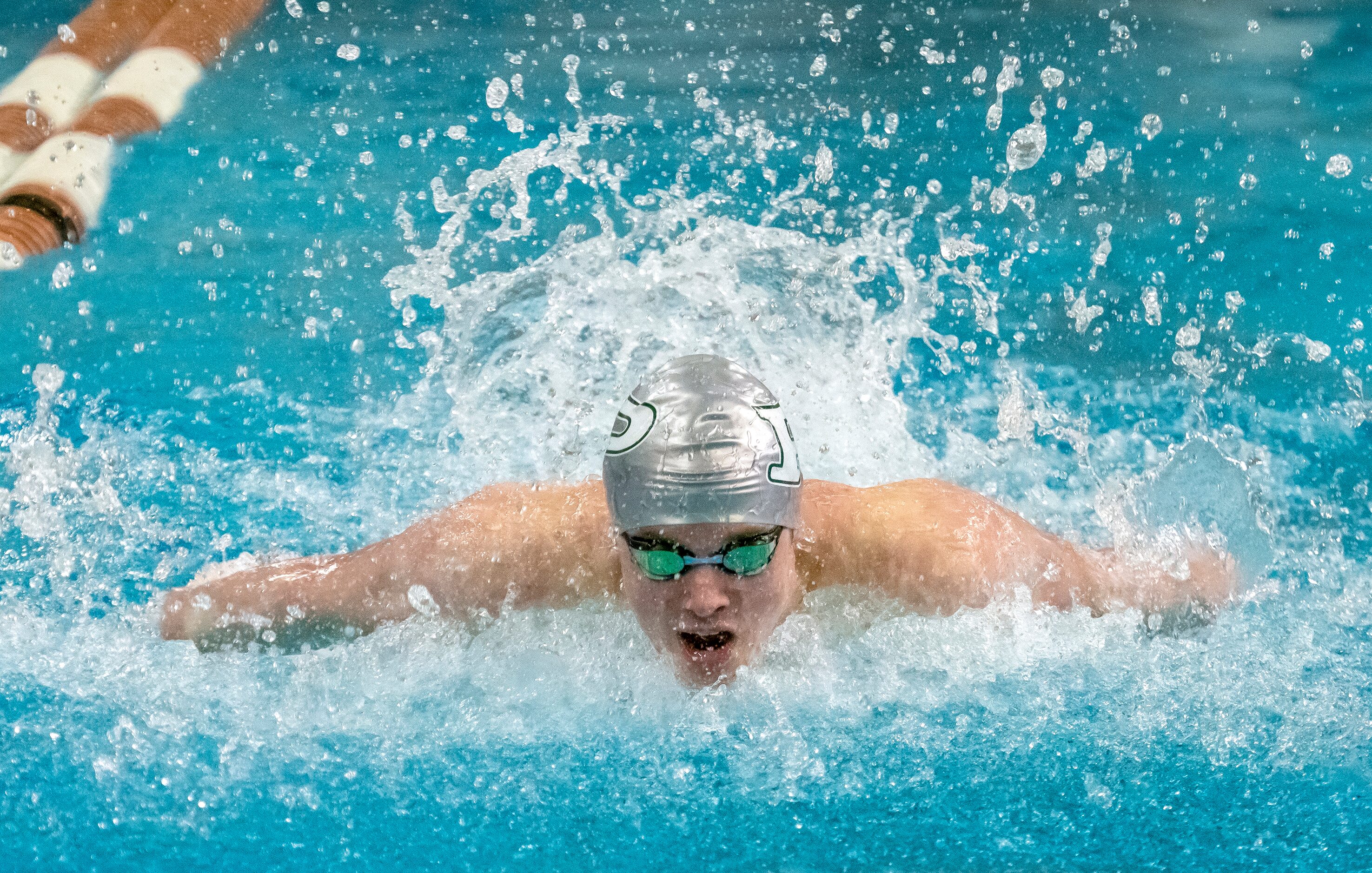 Prosper’s Jacob Wimberly, competes in the 100 butterfly during the 2023 UIL Swim & Dive...