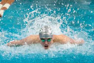 Prosper’s Jacob Wimberly, competes in the 100 butterfly during the 2023 UIL Swim & Dive...