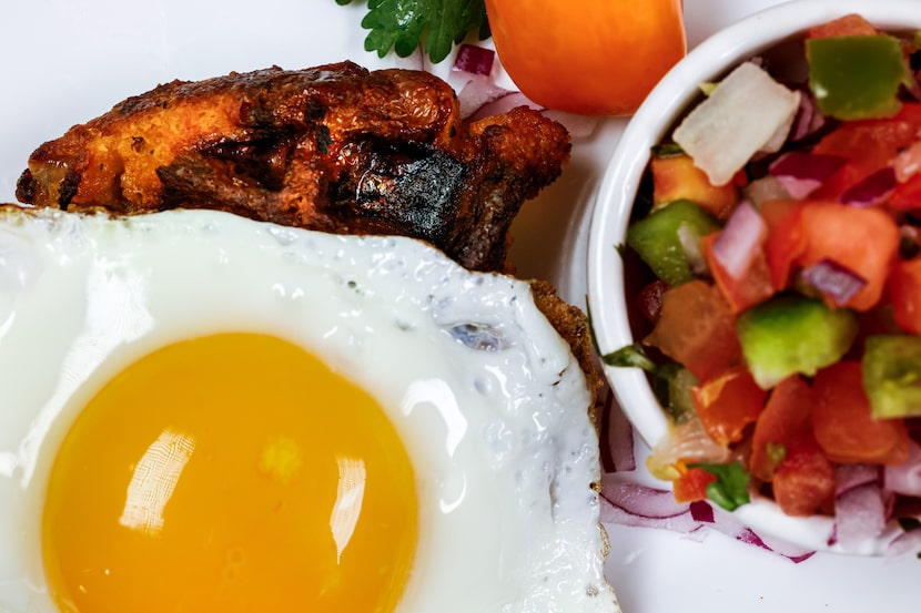 Southwest Cornbread Chorizo Waffles with a fried egg on top