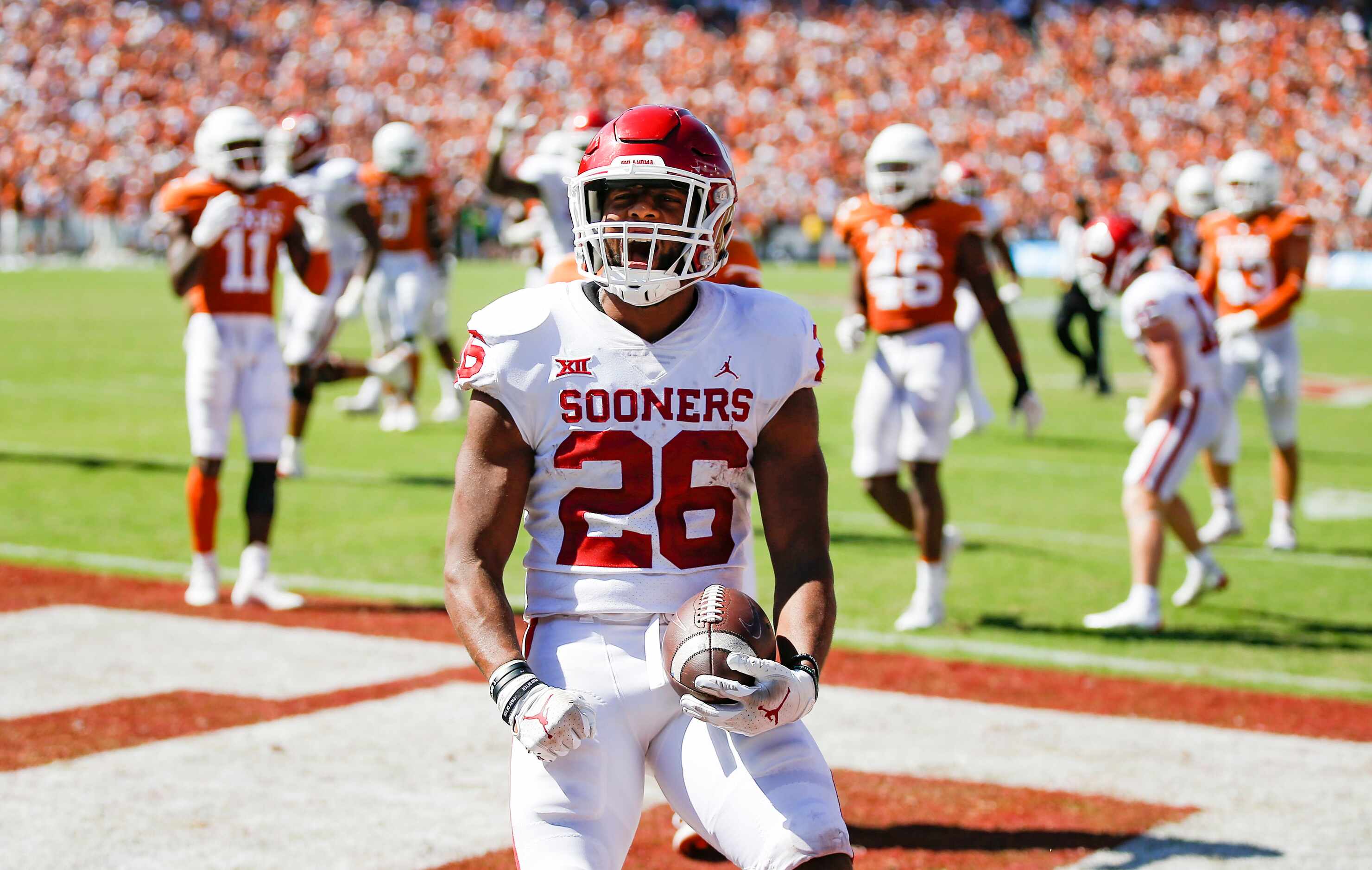Oklahoma running back Kennedy Brooks (26) scores a touchdown during the second half of an...