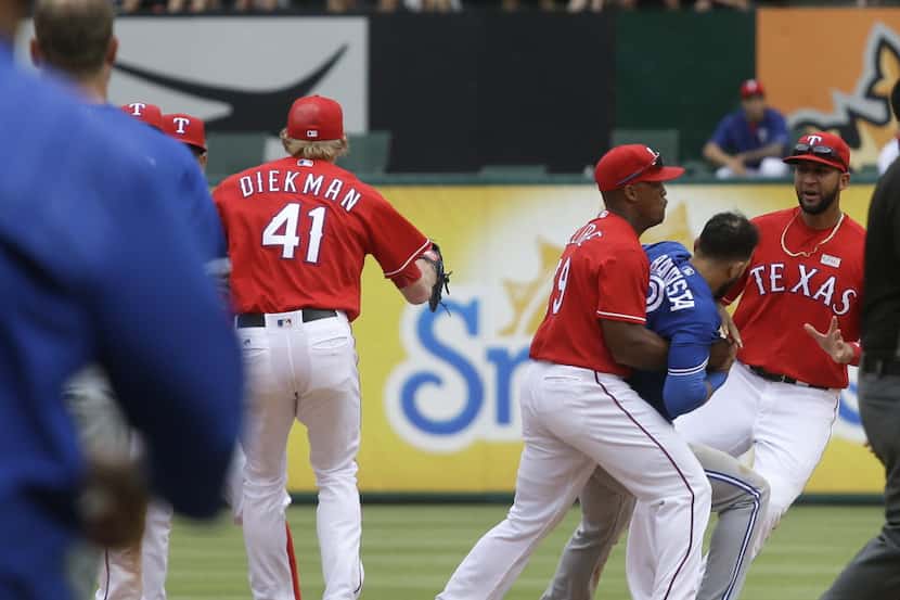 Texas Rangers third baseman Adrian Beltre (29) holds onto Toronto Blue Jays right fielder...