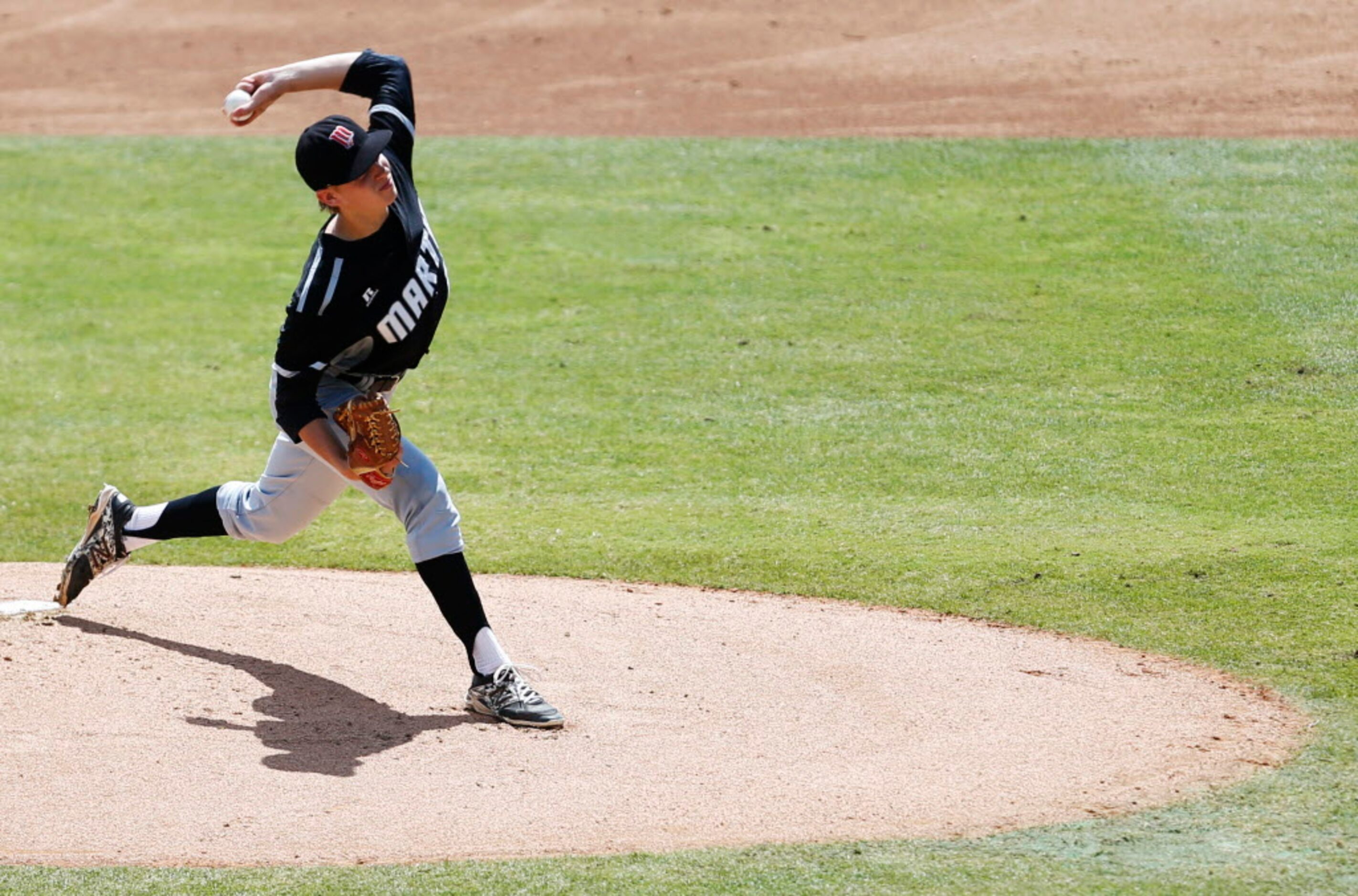 Martin's Nick Skeffington (15) pitches in a game against Cypress Ranch during the first...