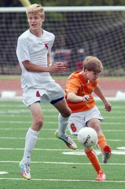 Frisco Wakeland's Dylan Rakestraw (6, right) kicks the ball past Frisco Liberty's Keaton...