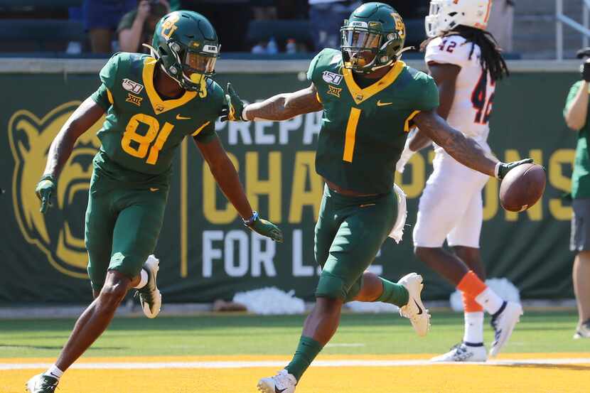 Baylor cornerback Grayland Arnold, right, celebrate with wide receiver Tyquan Thornton,...