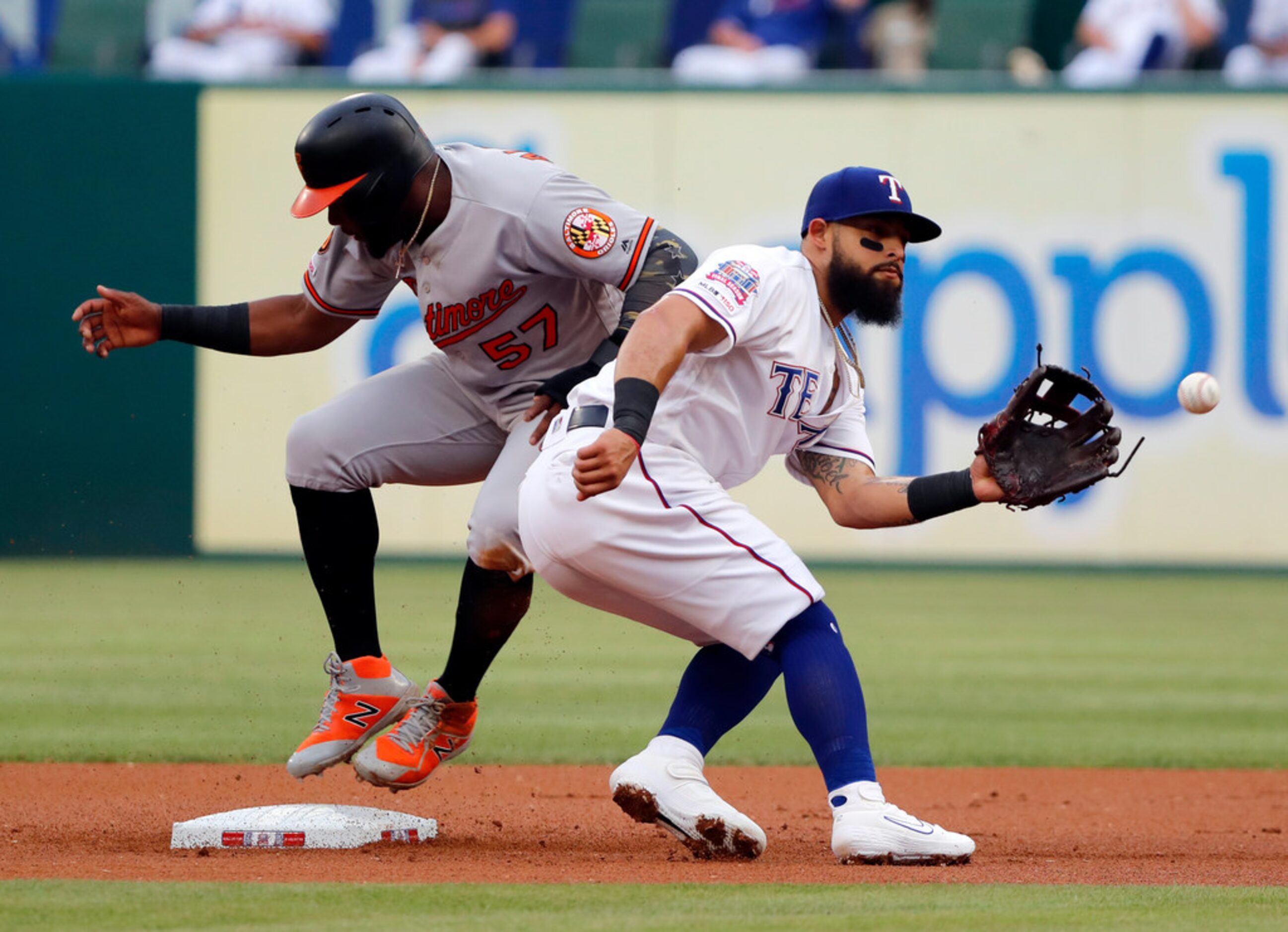 Texas Rangers second baseman Rougned Odor (12) reaches out for the throw to the bag as...