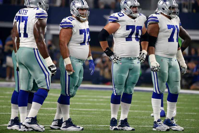 FILE - In this Sept. 10, 2017, file photo, Dallas Cowboys offensive tackle Tyron Smith (77),...