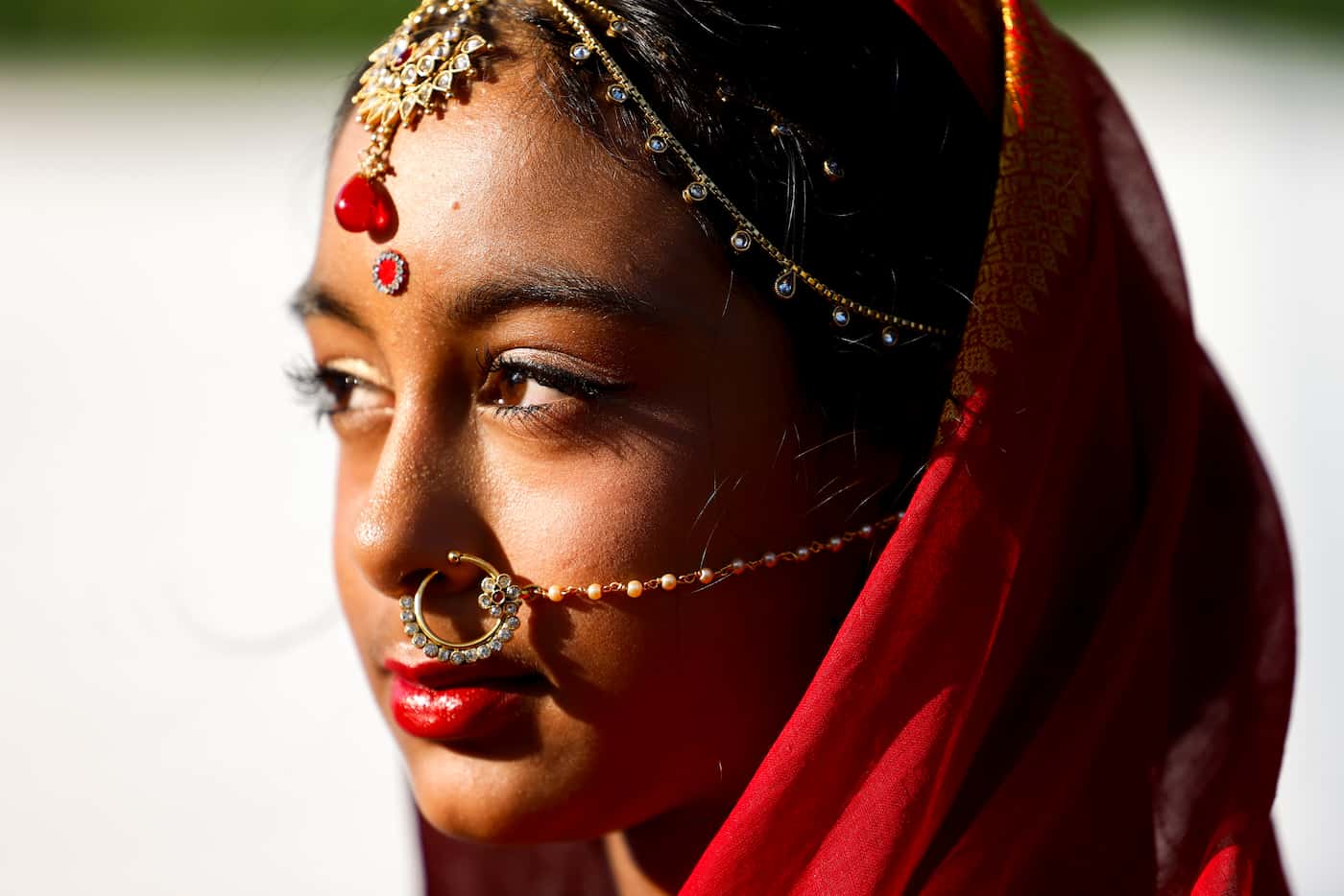 Raisa Siddique, 11, dressed with a traditional Bangladeshi bride attire, waits for her turn...