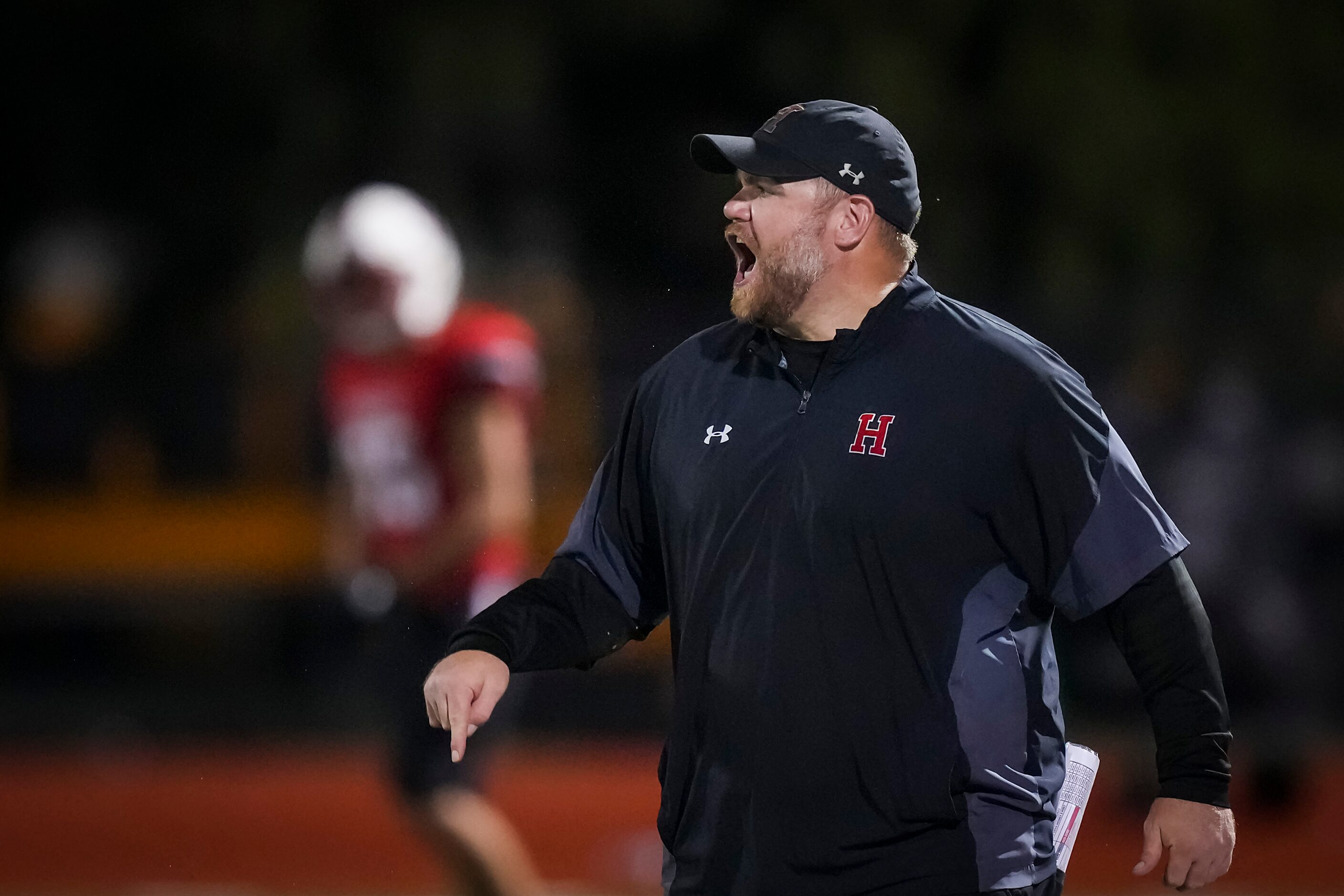 Rockwall-Heath head coach John Harrell works the sidelines during the second half of a high...