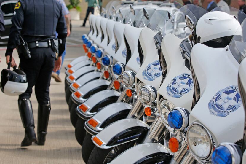 Dallas Police motorcycle officer arrive for the funeral service for Dallas Police Department...