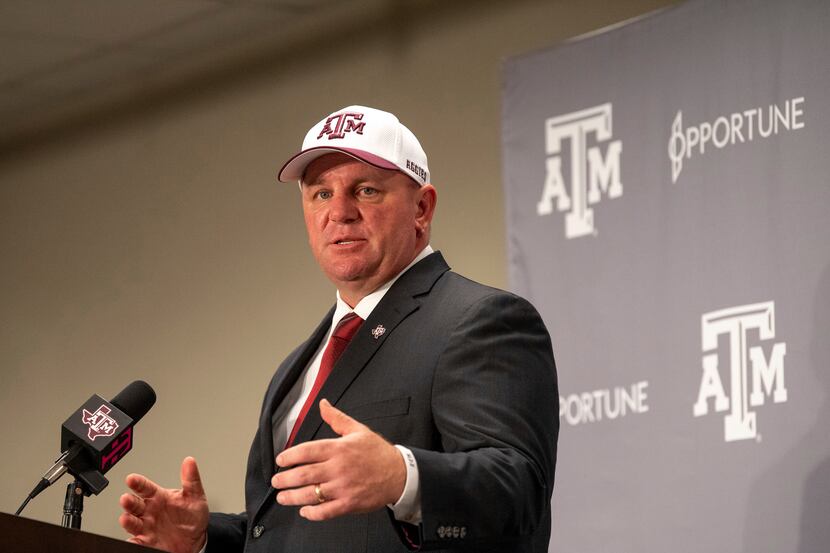 Newly appointed Texas A&M head coach Mike Elko speaks to the press on Monday, Nov. 27, 2023,...