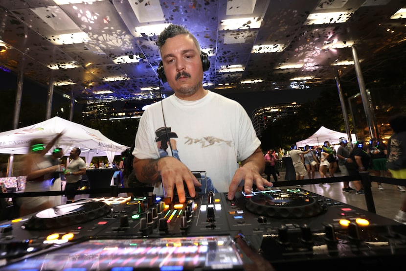 DJ Bishiclet spins tunes during a silent disco at Klyde Warren Park in Dallas on Sept. 6, 2024.