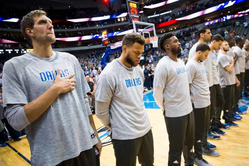 Dallas Mavericks forward Dirk Nowitzki (from left), guard Justin Anderson, and guard Wesley...